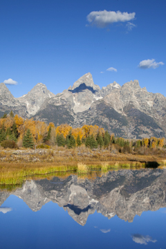 The Grand Teton Mountain Range Is Reflected In The Snake River