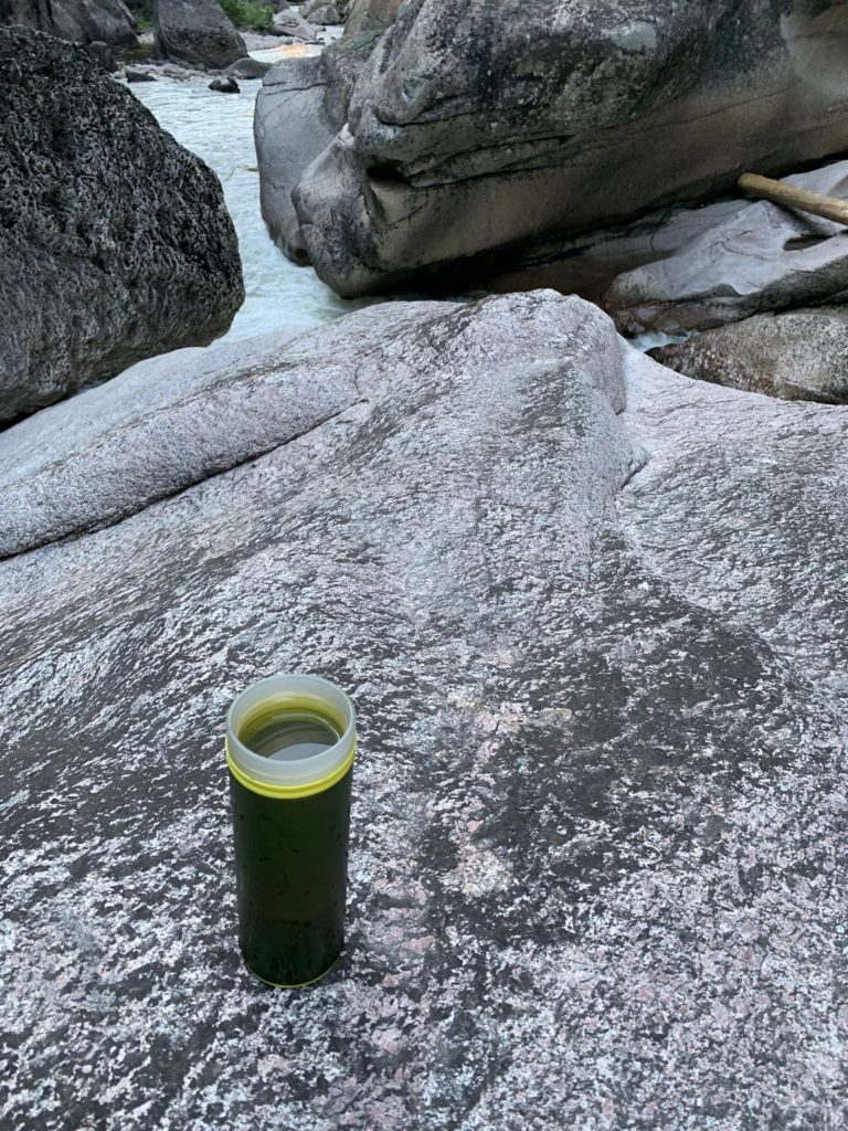 water bottle on rock