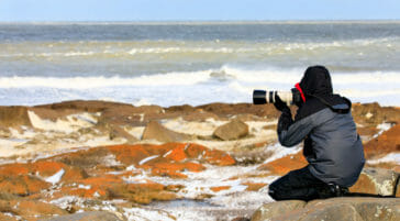 Photographer along the Hudson Bay near Churchill Manitoba.