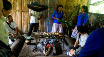 family in ecuador cooking over fire