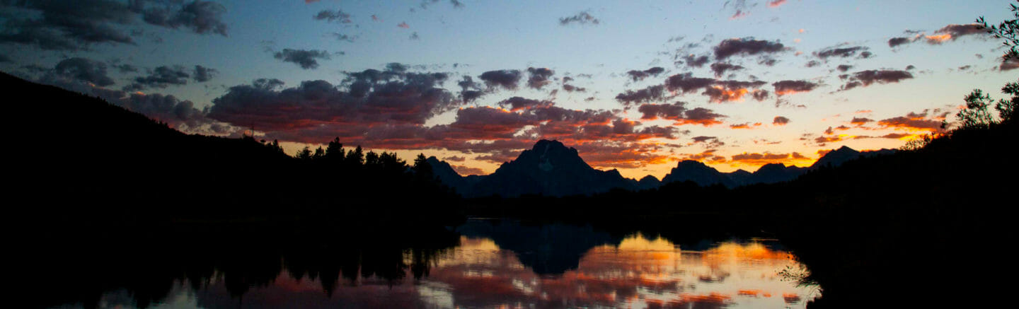 Sunset the Tetons reflected in the Oxbow Bend of the Snake River.