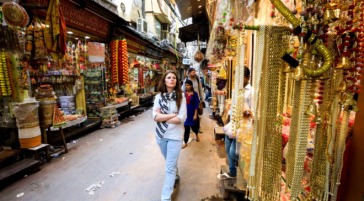 tourists walking through market