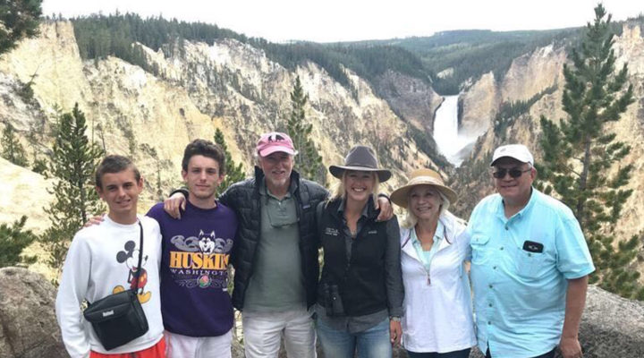 Professional Guide Ash Tallmadge Stands With Wildlife Safari Guests At The Overlook To The Lower Falls In Yellowstone National Park
