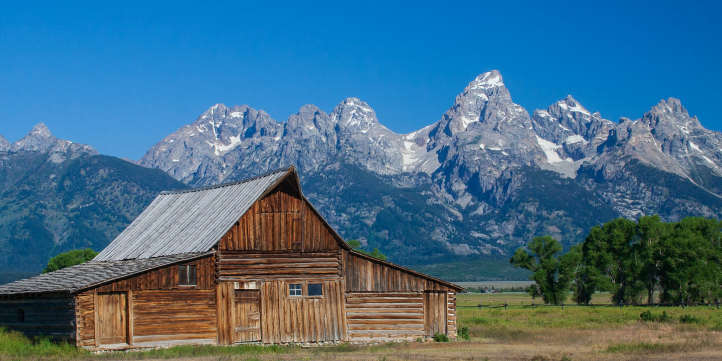 The Moulton Barn With The Grand Tetons In The Background Is A Historic Jackson Hole Site