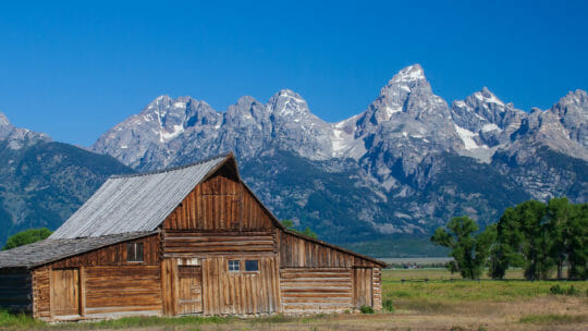 The Moulton Barn With The Grand Tetons In The Background Is A Historic Jackson Hole Site