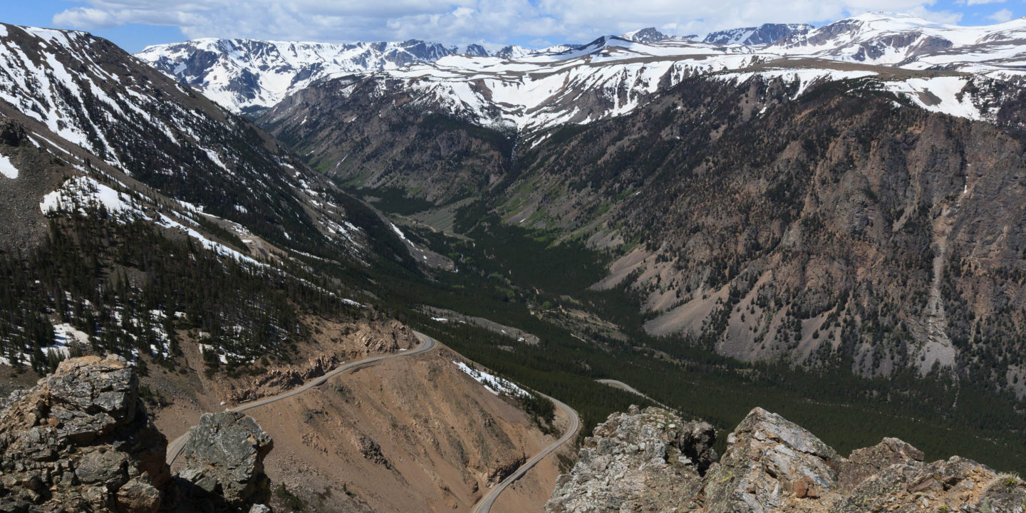 Distant Snow Capped Peaks Are Visible In A Panoramic View From High Altitude Along Dunraven Pass In Yellowstone National Park